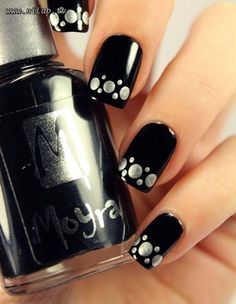 Beautiful polka dot nail art on black base