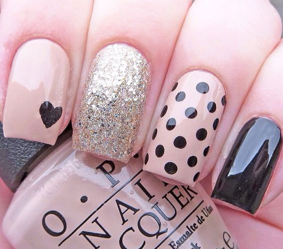 Classy nail art with polka dots and glitter