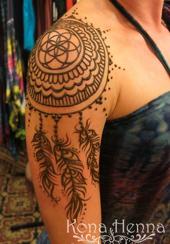 Henna style tattoo on the right upper arm and shoulder