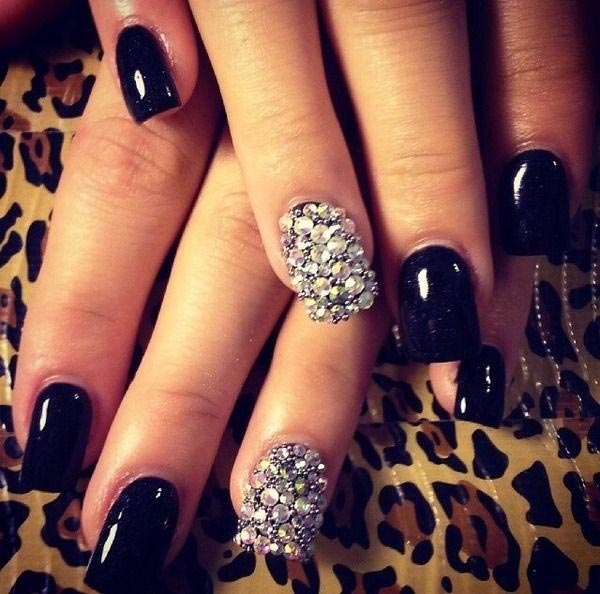 Rhinestone studded black nail art design