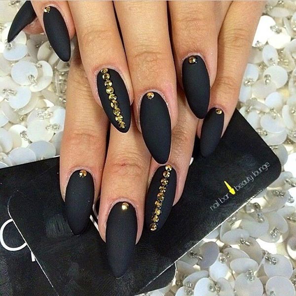 Classy black matte nails with golden studs