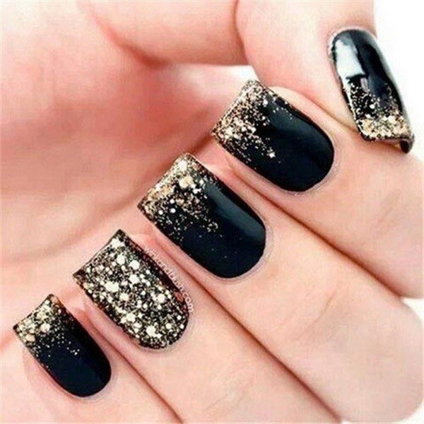 splatter gold nail art on black polish