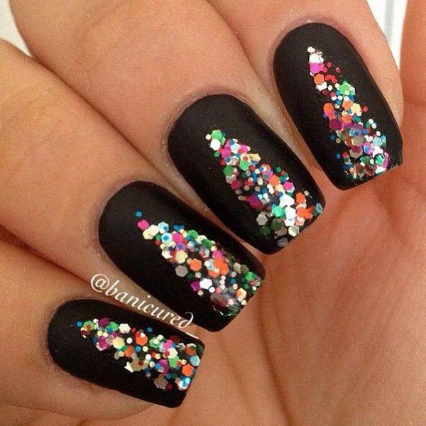 Colourful sequin design on black nails