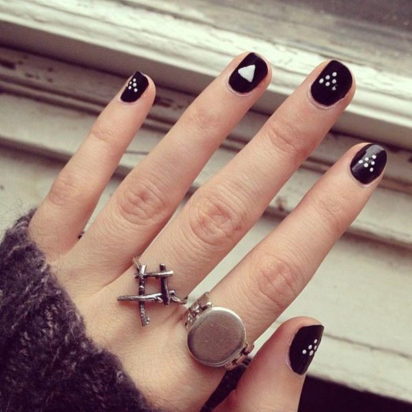 Simple black nail art with polka dots