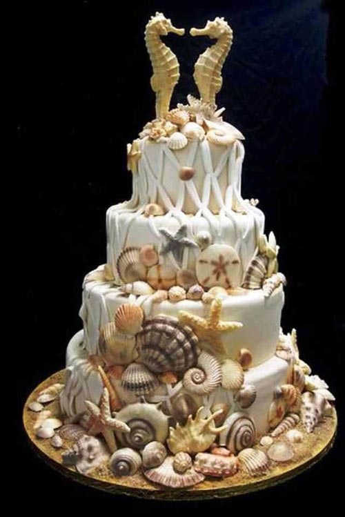 Beach wedding cake with sea horse toppers