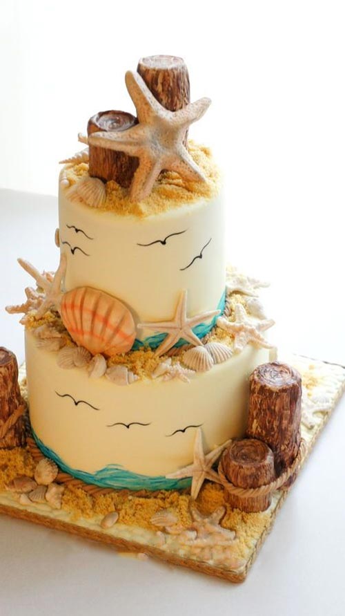 Perfect beach wedding cake with sea,bird,sand,shells and everything