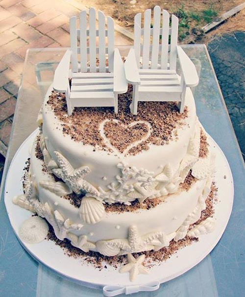 beach wedding cake with chair toppers