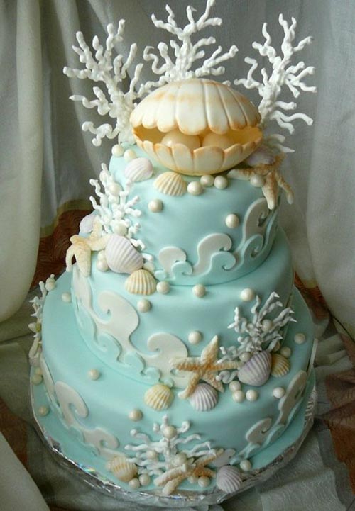 sea blue cake with oyster and pearl topper