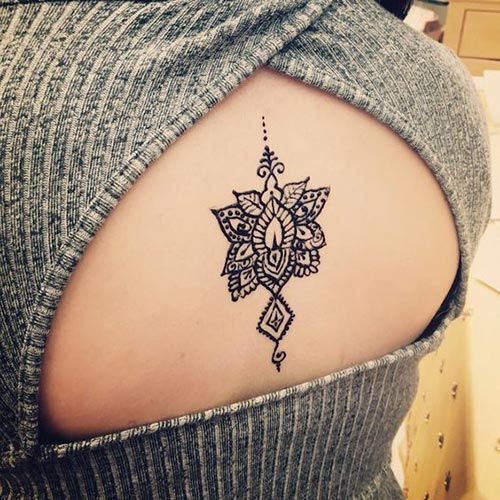 Attractive lotus henna tattoo for back