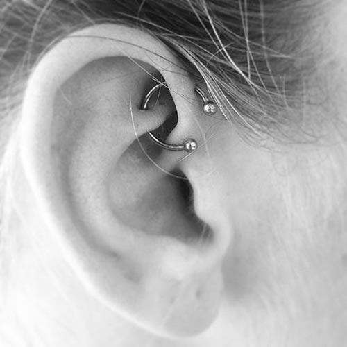 Piercing through rook and forward helix