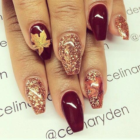 Burgundy glitter and maple leaf nails