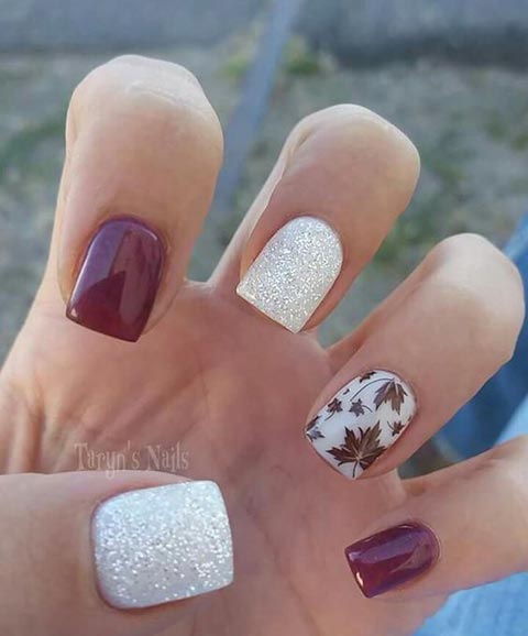 Nails with white glitter burgundy and a leaf accent nail