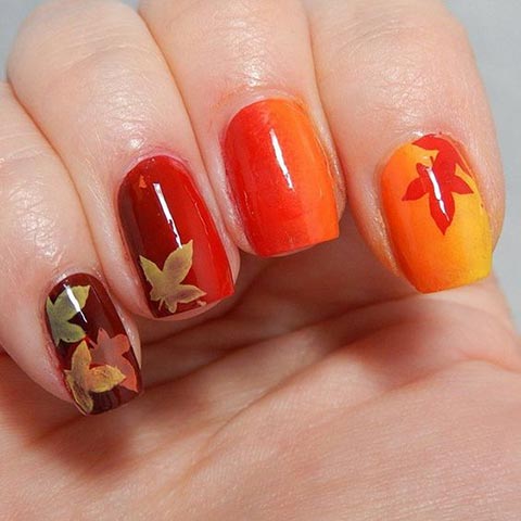 Ombre yellow to red nails with leaves