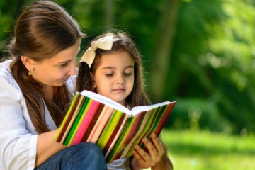 Mother teaching learning techniques to her daughter