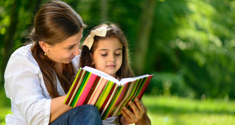 Mother teaching learning techniques to her daughter