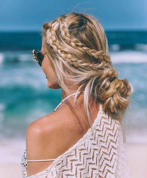 Side braids with a loose bun beach hairstyles