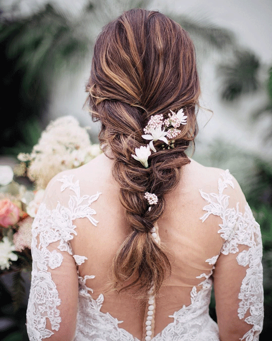 Loose braid wedding hairstyles with flowers