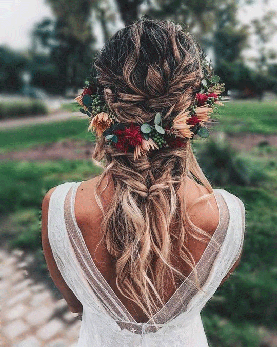 Messy twisted braid wedding hairstyles with flowers