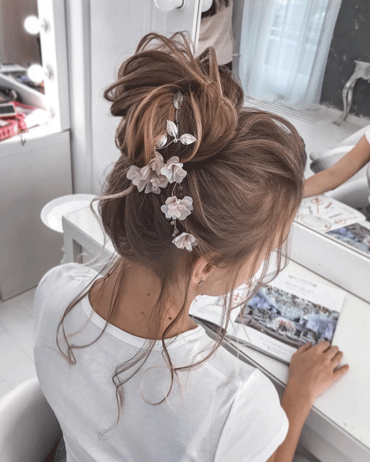 Up do flower bun hairstyle