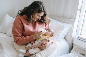 you can start dry infant rice cereal first mixed as directed