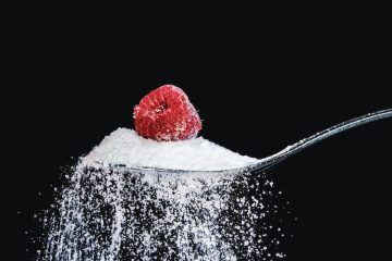 A spoon of raspberry and sugar used as a metaphor for type 1 diabetes.