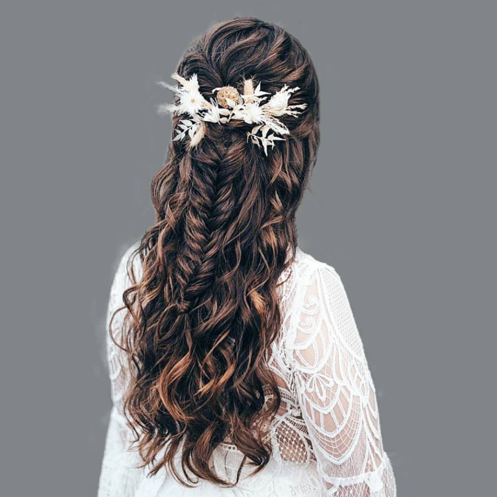 Bohemian beauty: Image featuring charming braids and waves, perfect for a free-spirited bridal look.