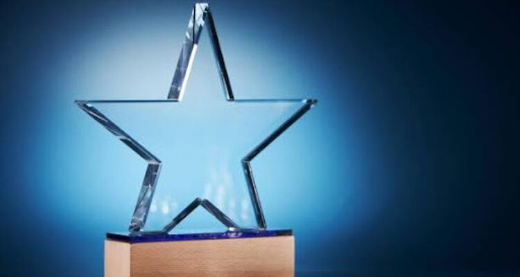 Crystal-clear glass trophy award, symbolizing achievement and excellence.