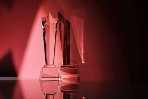 Crystal-clear glass trophy award, symbolizing achievement and excellence.