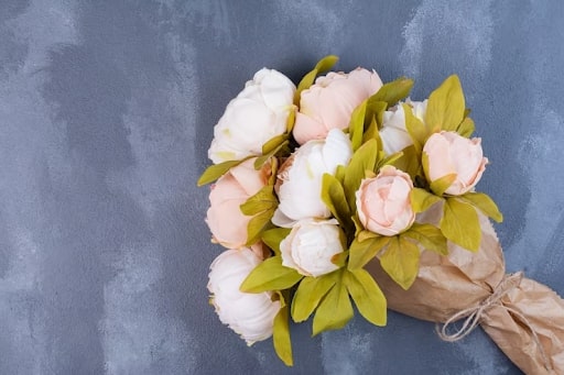 Peonies wedding bouquet - lush blooms exuding timeless romance and elegance.