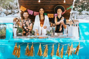 Mobile bar setup at a wedding, offering refreshments to guests.