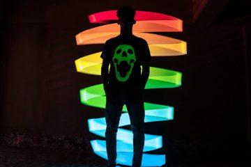 Person wearing a personalized glow shirt, showcasing unique style.