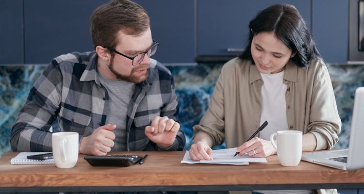 A couple discussing debt review and financial planning together