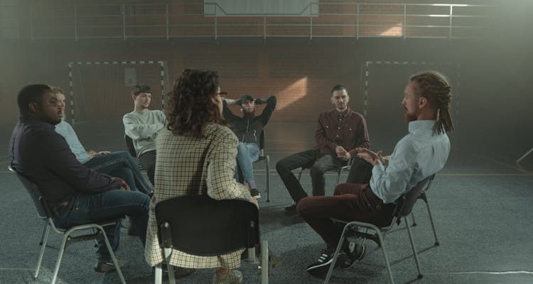 Image depicting a group session of addiction counseling.
