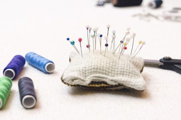 A sewing kit with fabric and tools, ready for DIY sewing projects to transform your living room.